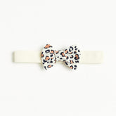 Girls white cheetah bow band
