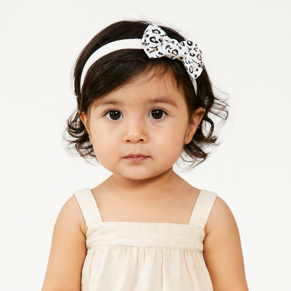 Girls white cheetah bow band