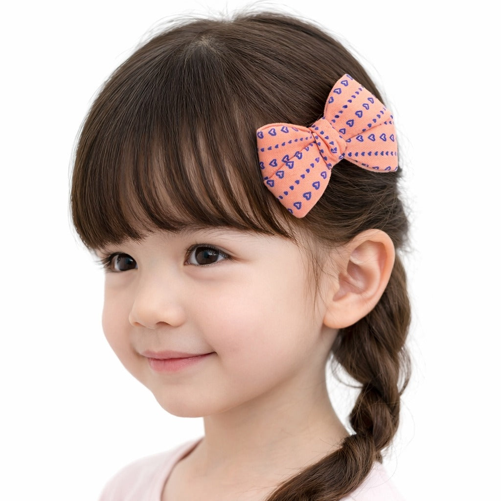 Girls peach heart bow pin