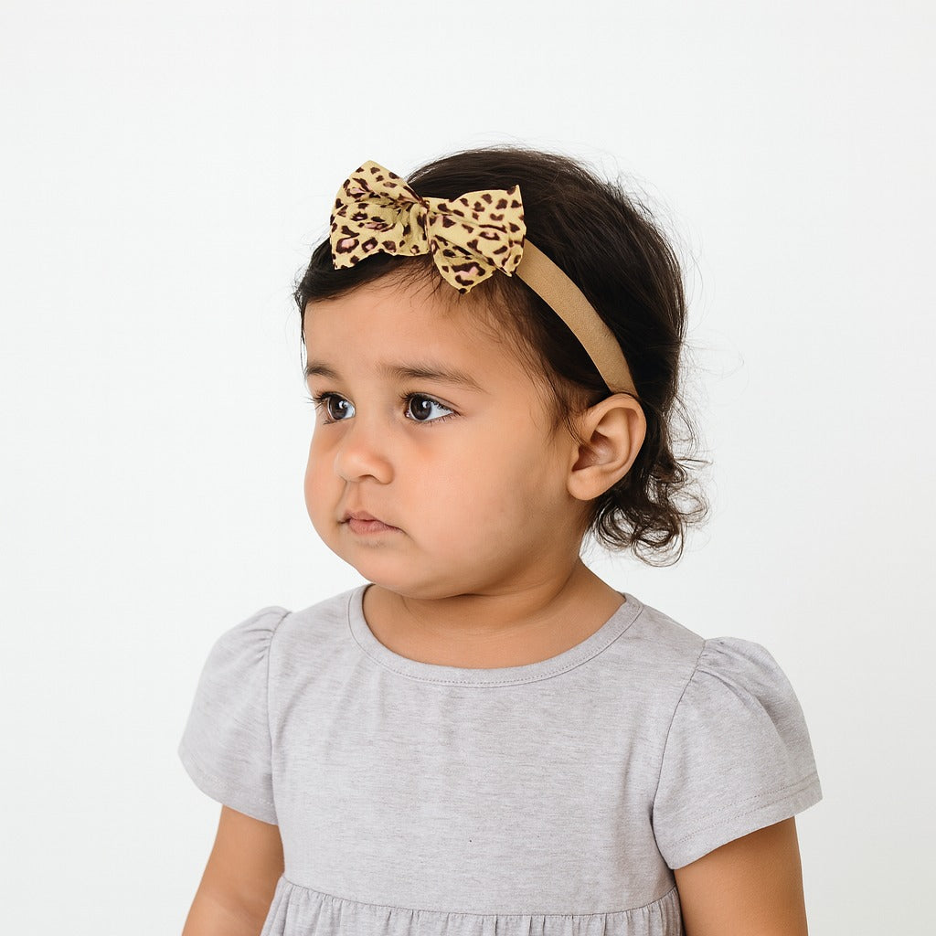 Girls brown cheetah bow band