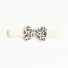 Girls white cheetah bow band