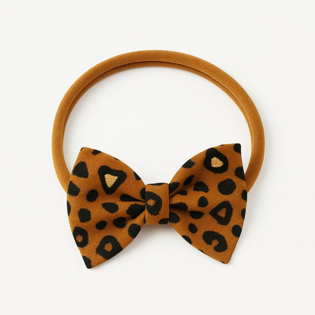 Girls brown cheetah bow band